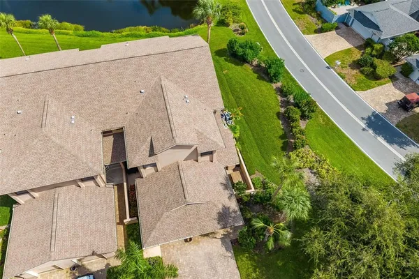an aerial view of a residential houses with outdoor space