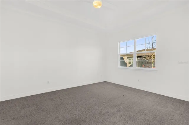 a view of empty room with windows