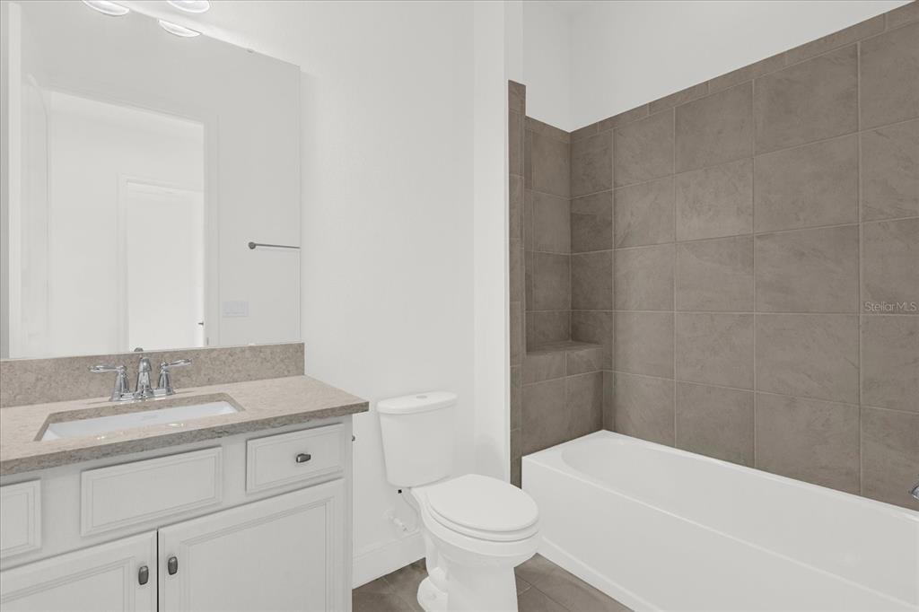 2360 Datura Loop St. Cloud, FL 34772 - Photo 15 of 46 a bathroom with a sink and a toilet