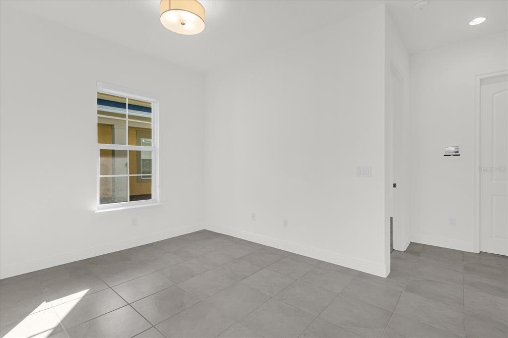 2360 Datura Loop St. Cloud, FL 34772 - Photo 19 of 46 an empty room with a window