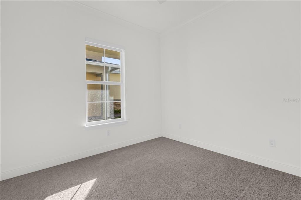 2360 Datura Loop St. Cloud, FL 34772 - Photo 20 of 46 an empty room with a window