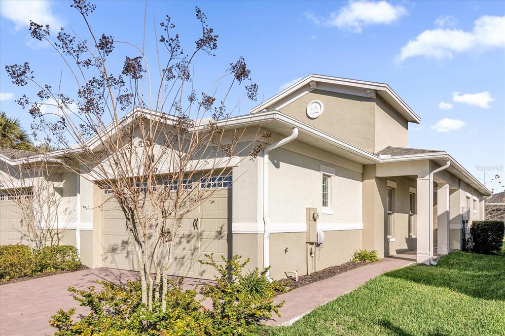 2360 Datura Loop St. Cloud, FL 34772 - Photo 2 of 46 a view of a building with a yard