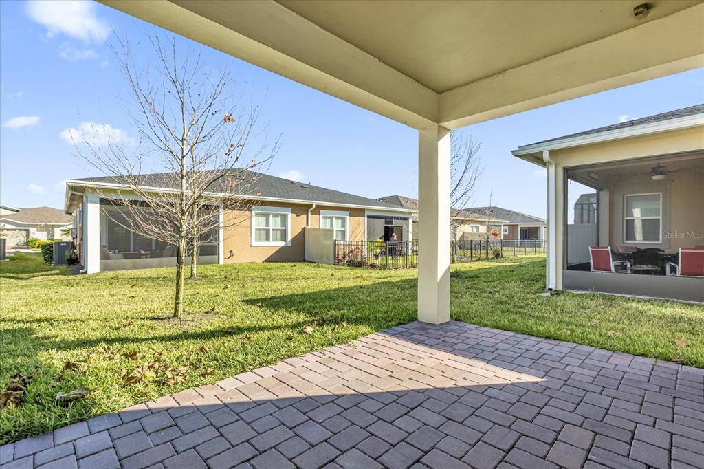2360 Datura Loop St. Cloud, FL 34772 - Photo 25 of 46 a view of a house with a yard