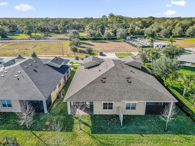 an aerial view of a house with a ocean view
