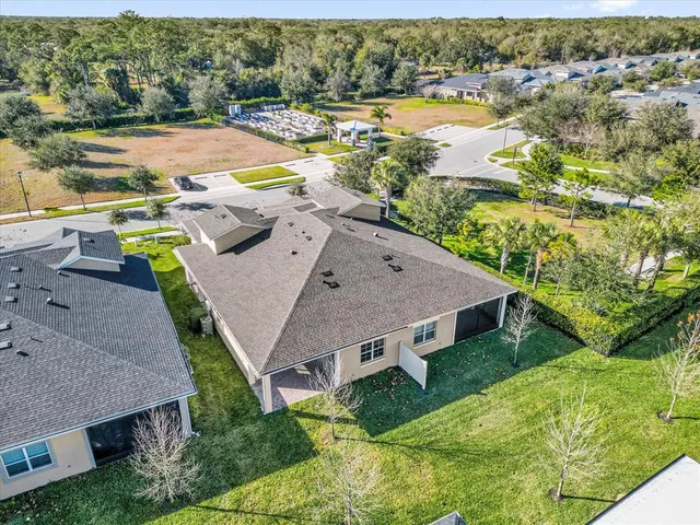 an aerial view of a house with a lake view