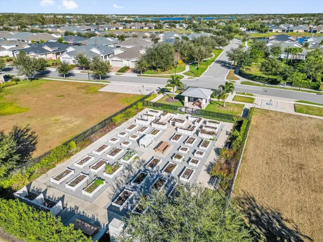 a view of a swimming pool and outside seating area