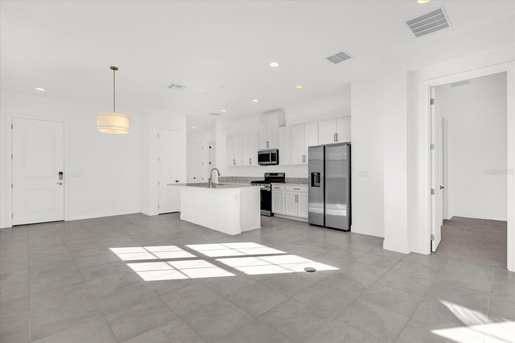 2360 Datura Loop St. Cloud, FL 34772 - Photo 5 of 46 a view of kitchen with refrigerator sink and cabinets