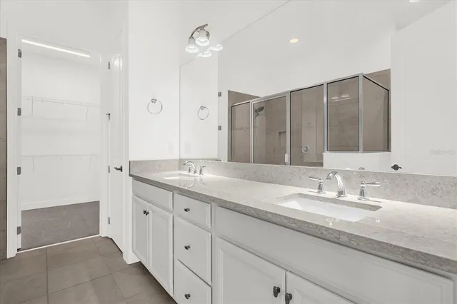 a bathroom with a shower and a glass door