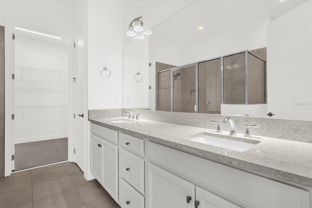 2360 Datura Loop St. Cloud, FL 34772 - Photo 10 of 46 a bathroom with a granite countertop sink mirror and double