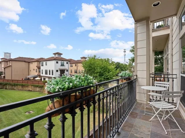 a view of a balcony with chairs