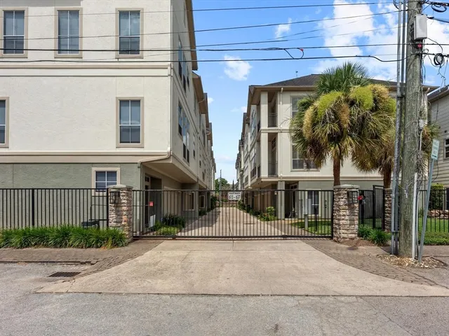a front view of a building with a garden