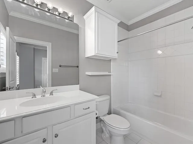 a bathroom with a sink a toilet and a bathtub