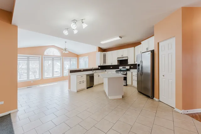 a spacious bathroom with a shower and a sink