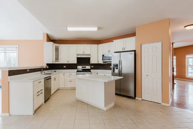 a bathroom with a shower a bath tub and a shower