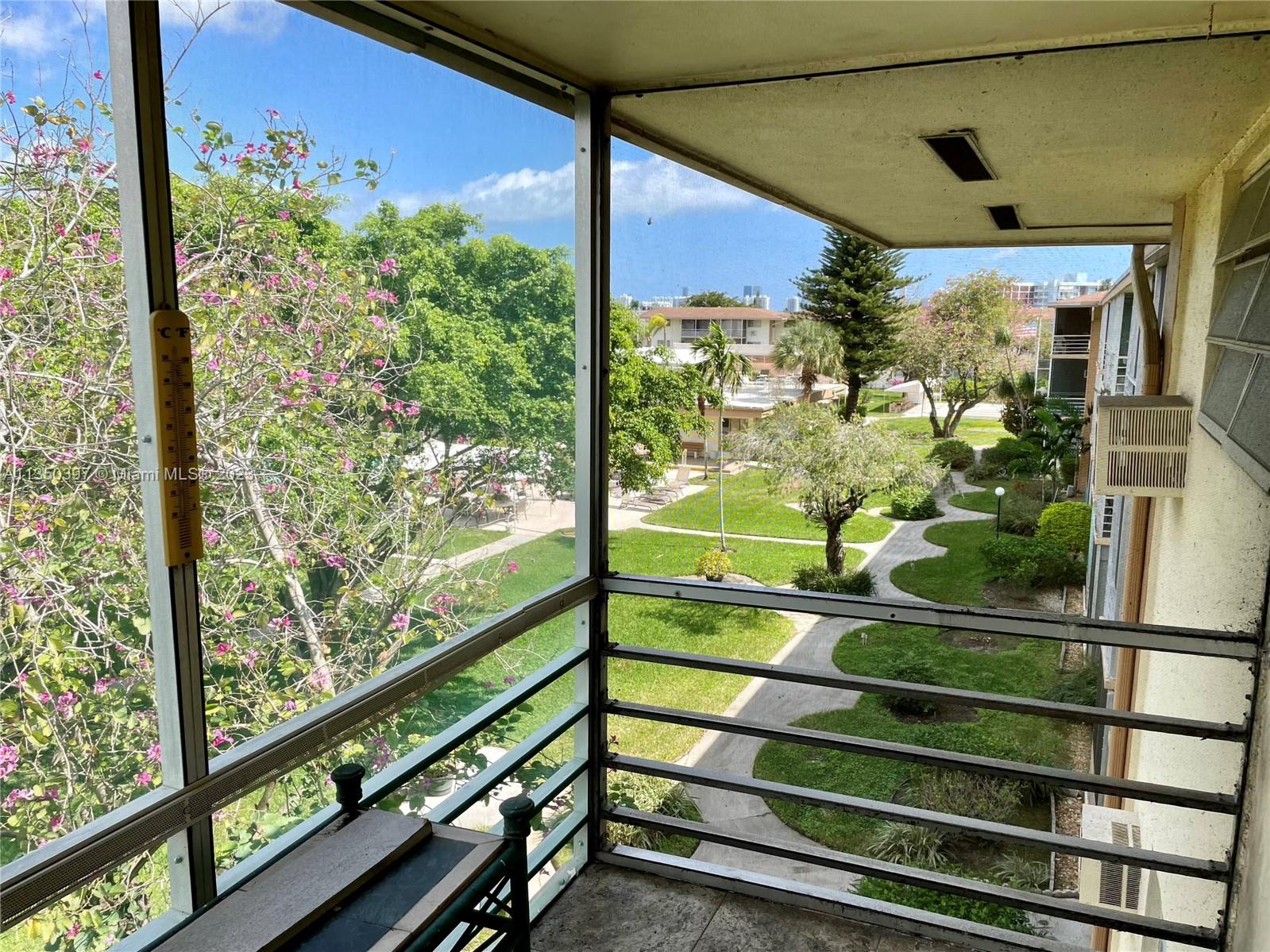 16801 Northeast 13th Avenue, Unit 304 Miami, FL 33162 - Photo 1 of 19 a view of a porch