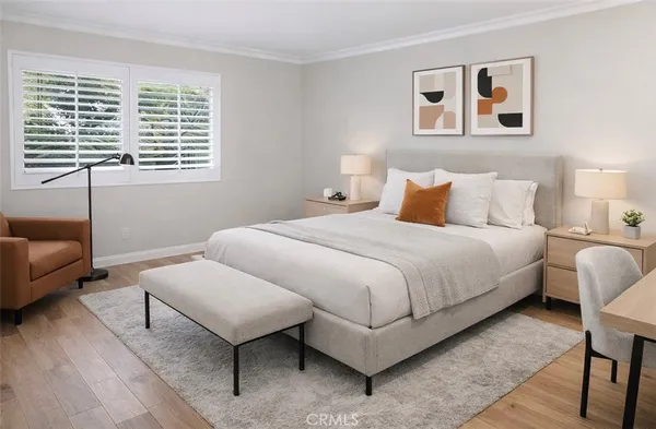 a bedroom with a bed and a couch