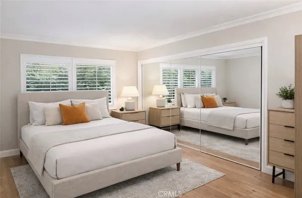 a bedroom with a bed and a couch