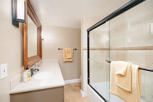 a bathroom with a sink and mirror