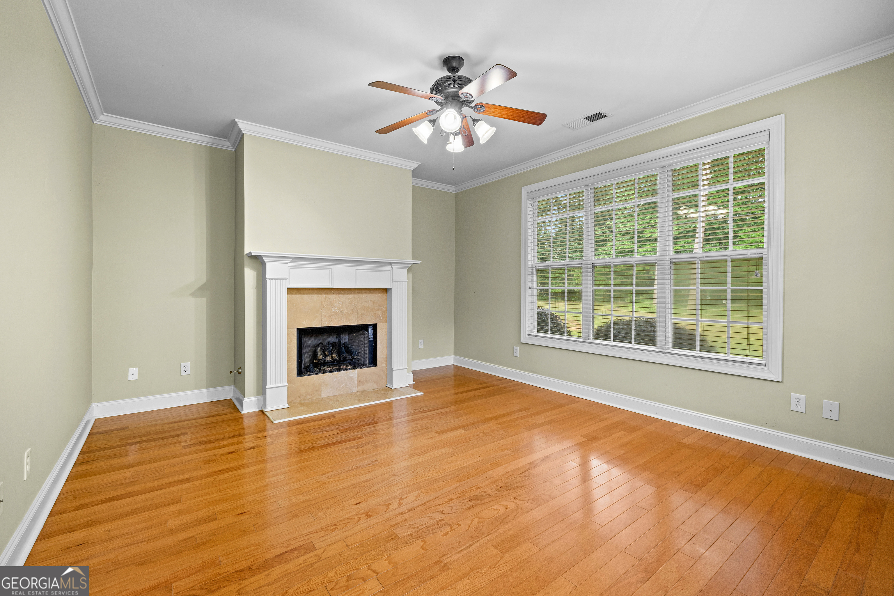 120 Shankhill Ridge Tyrone, GA 30290 - Photo 13 of 54 a view of an empty room with a fireplace and a window