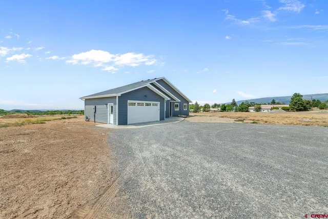 a view of a big room with wooden floor and fence