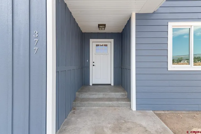 a view of front door with stairs