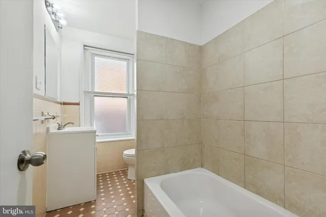 an empty room with a empty space and windows