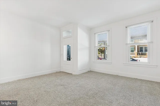 an empty room with windows