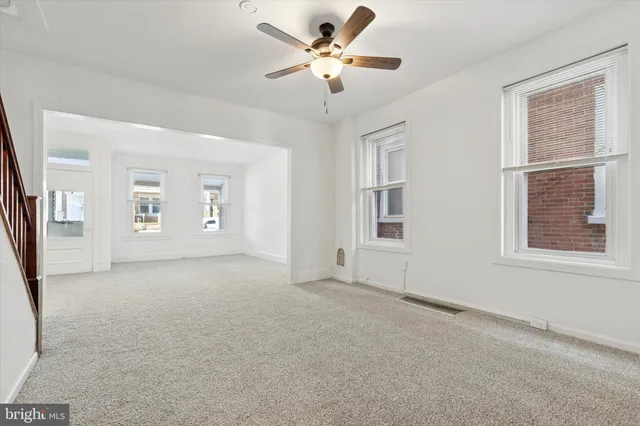 a view of an empty room with a window