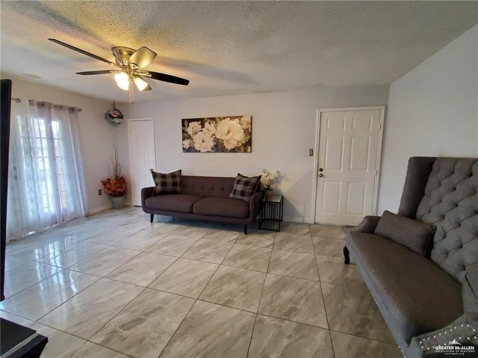 712 Toronto Avenue, Unit 6 McAllen, TX 78503 - Photo 3 of 10 a living room with furniture and a ceiling fan