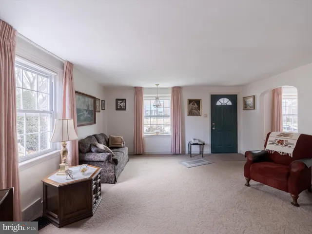 a living room with furniture and windows
