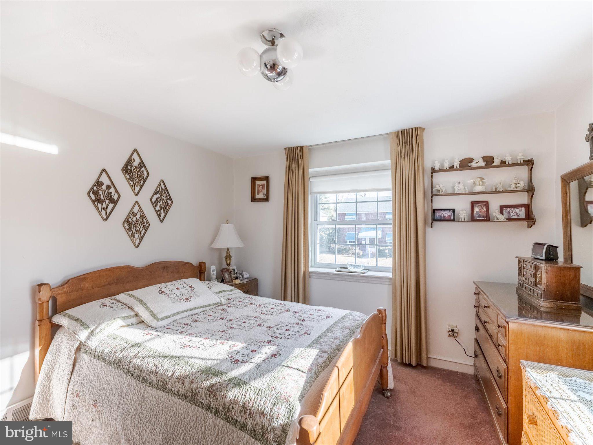 34 Schuyler Road Springfield, PA 19064 - Photo 23 of 30 a bedroom with a bed and a desk