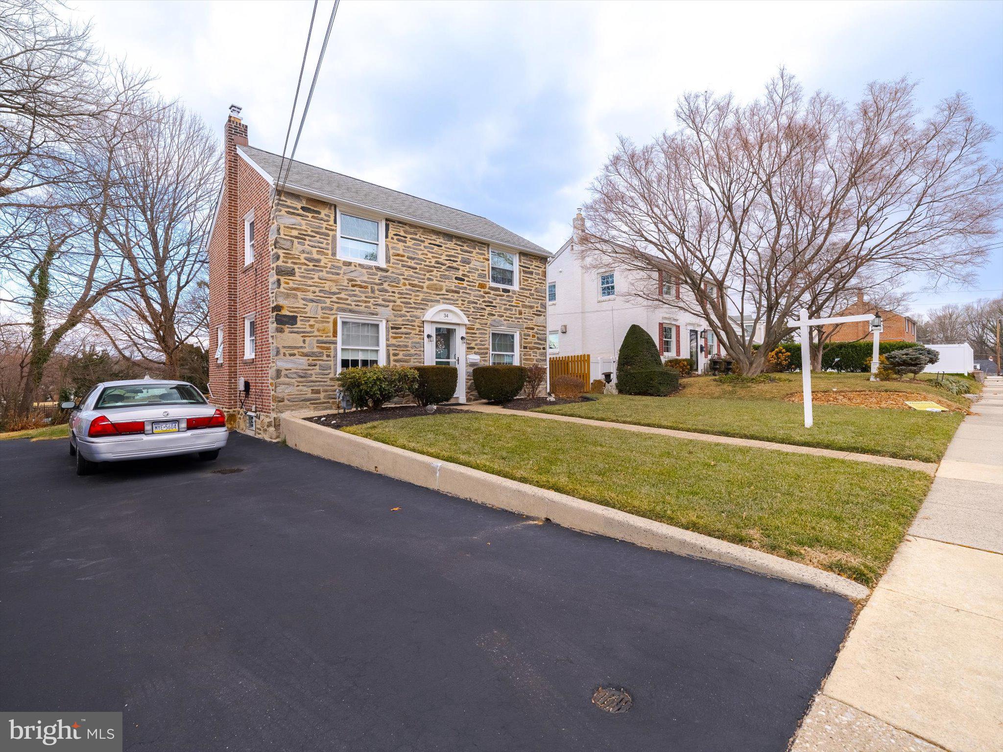 34 Schuyler Road Springfield, PA 19064 - Photo 7 of 30 a car parked on the side of the road