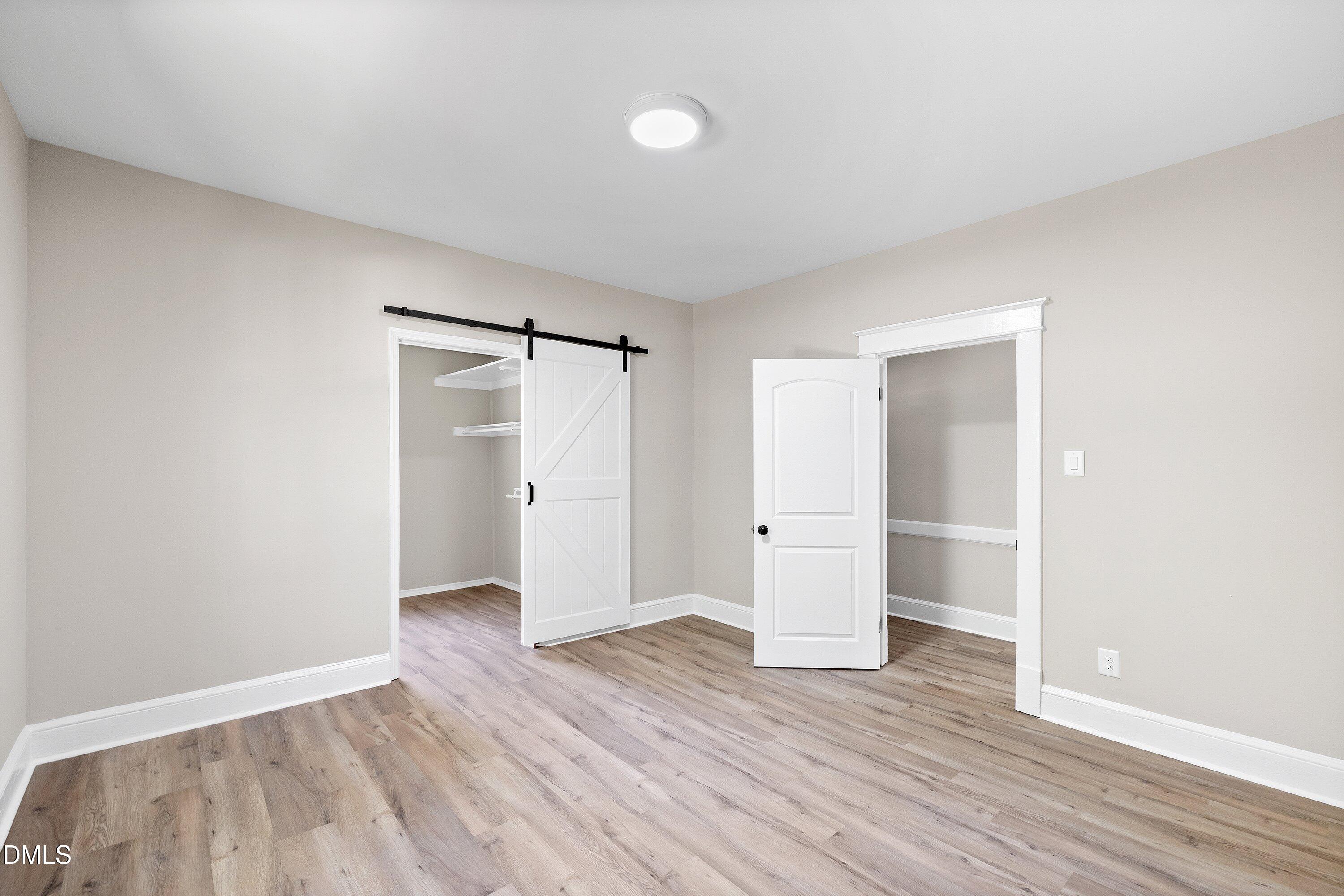 411 West I Street Erwin, NC 28339 - Photo 15 of 28 a view of an empty room and wooden floor