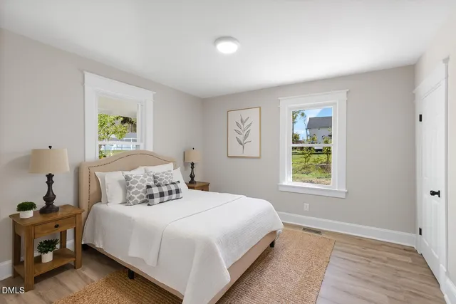 a bedroom with a bed and a window