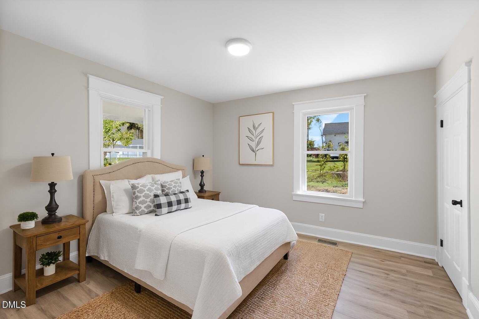 411 West I Street Erwin, NC 28339 - Photo 20 of 28 a bedroom with a bed and a window