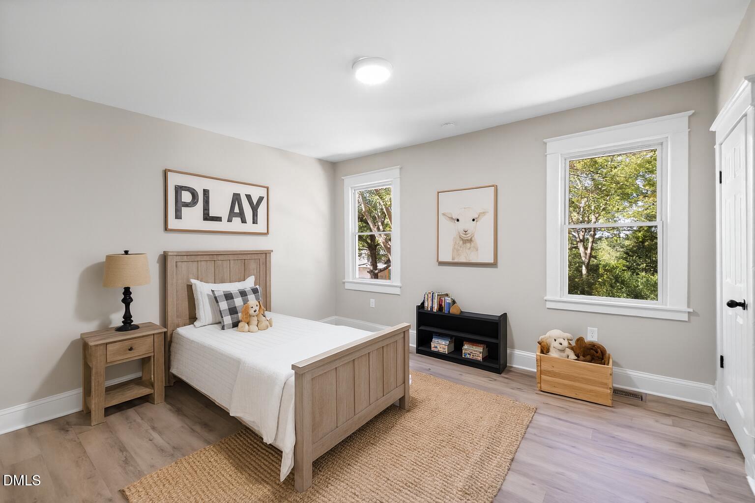 411 West I Street Erwin, NC 28339 - Photo 23 of 28 a bedroom with a bed and a couch