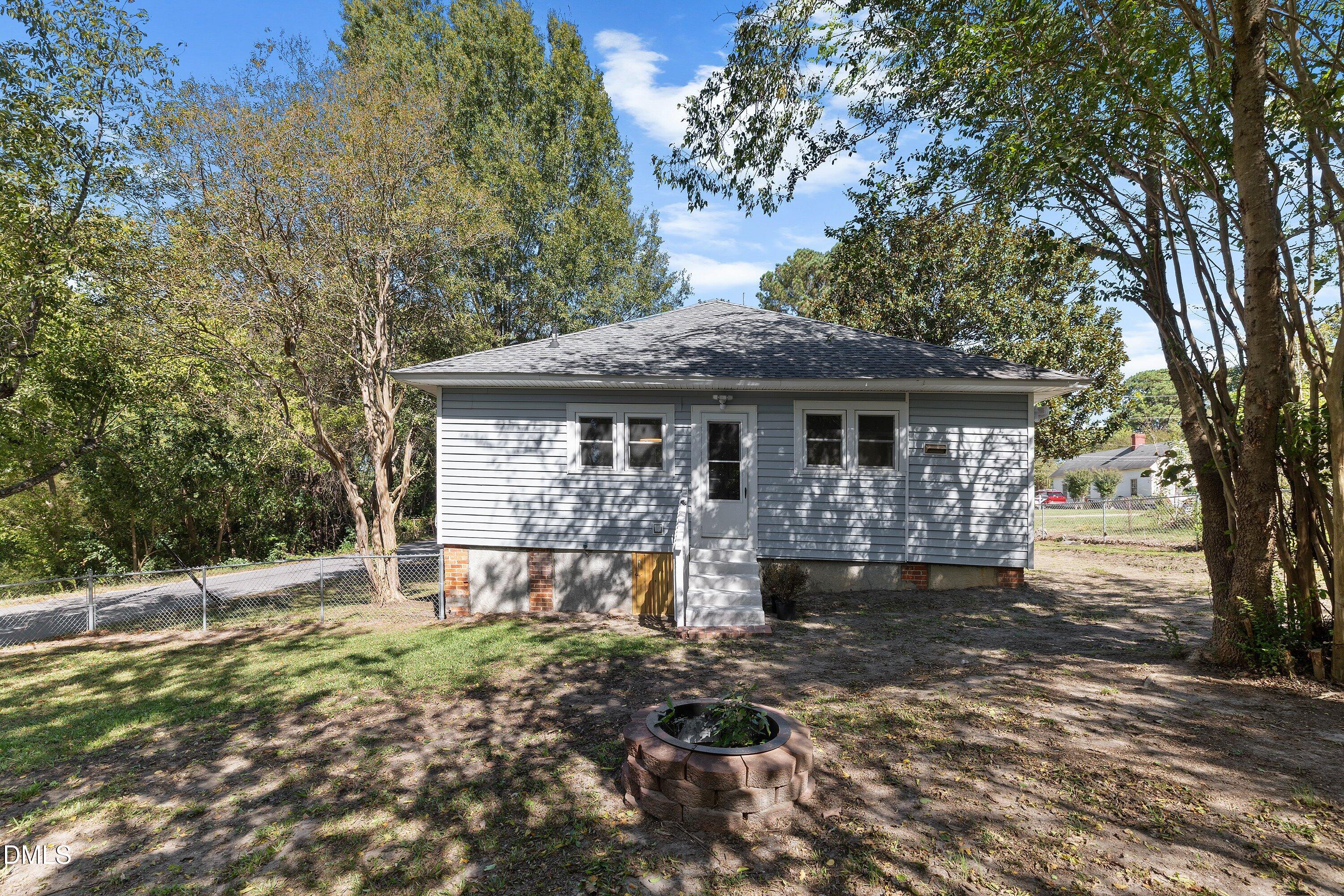 411 West I Street Erwin, NC 28339 - Photo 27 of 28 a front view of a house with a yard