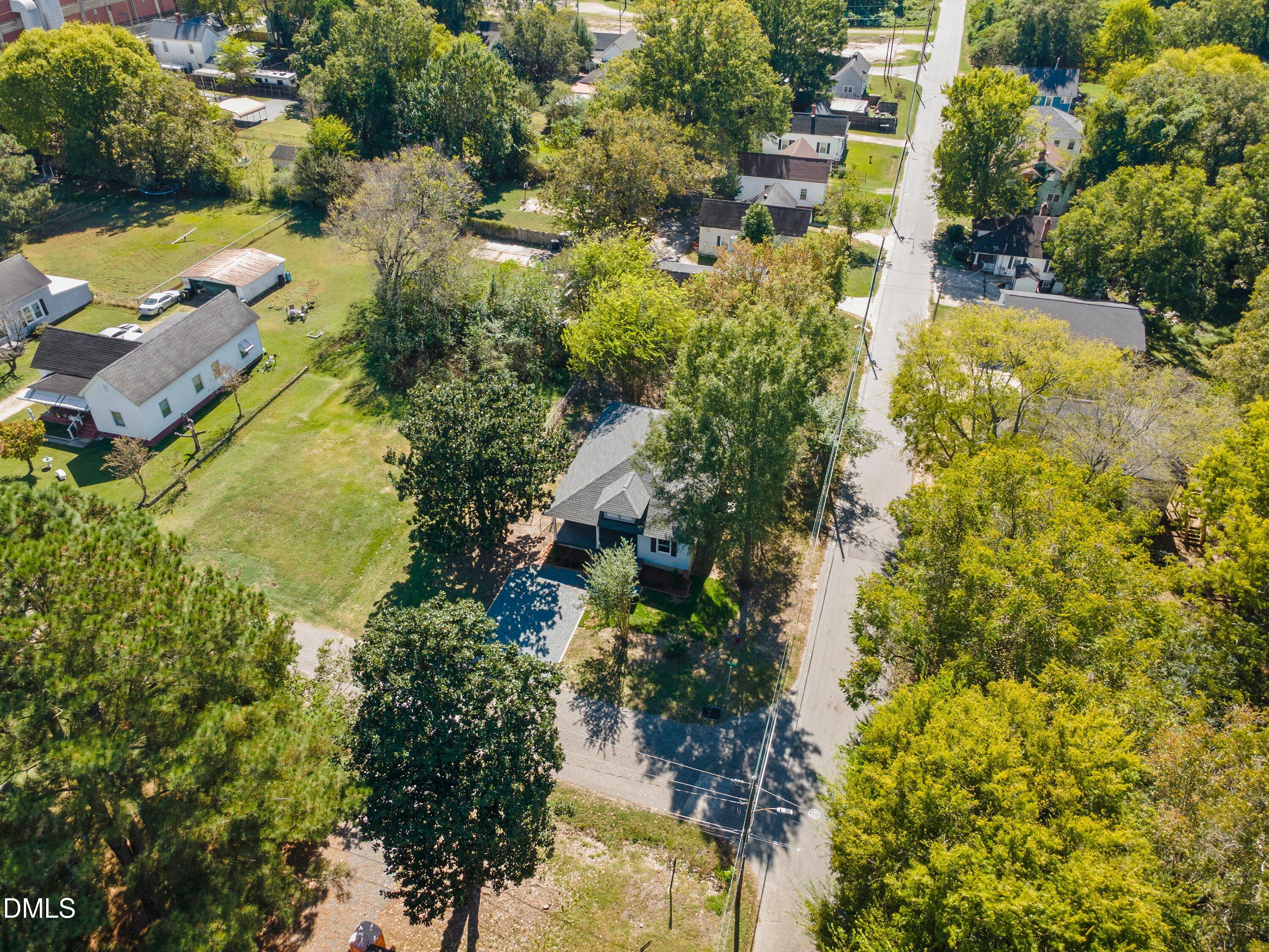 411 West I Street Erwin, NC 28339 - Photo 4 of 28 an aerial view of residential houses with yard and swimming pool