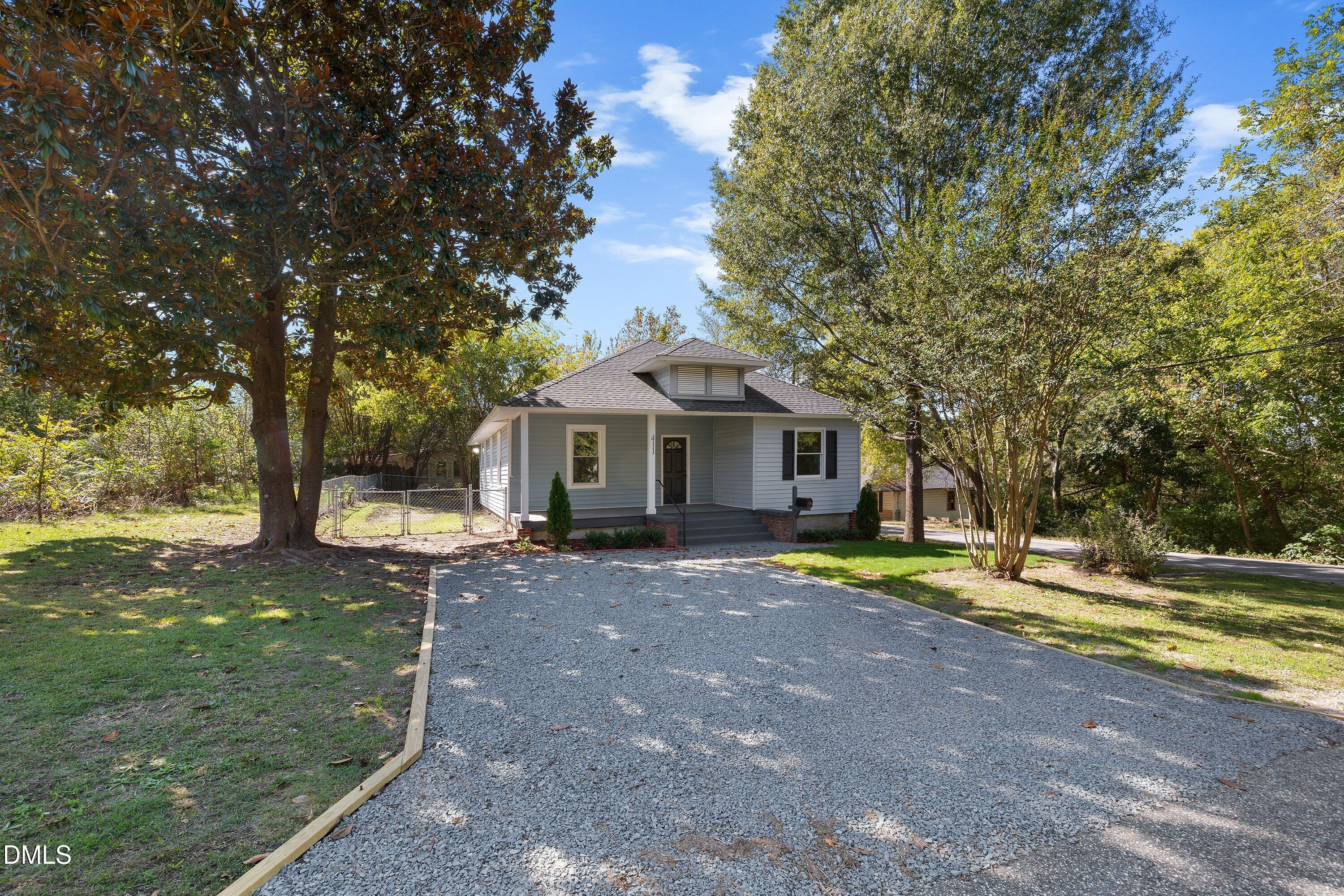 411 West I Street Erwin, NC 28339 - Photo 6 of 28 a front view of a house with a yard