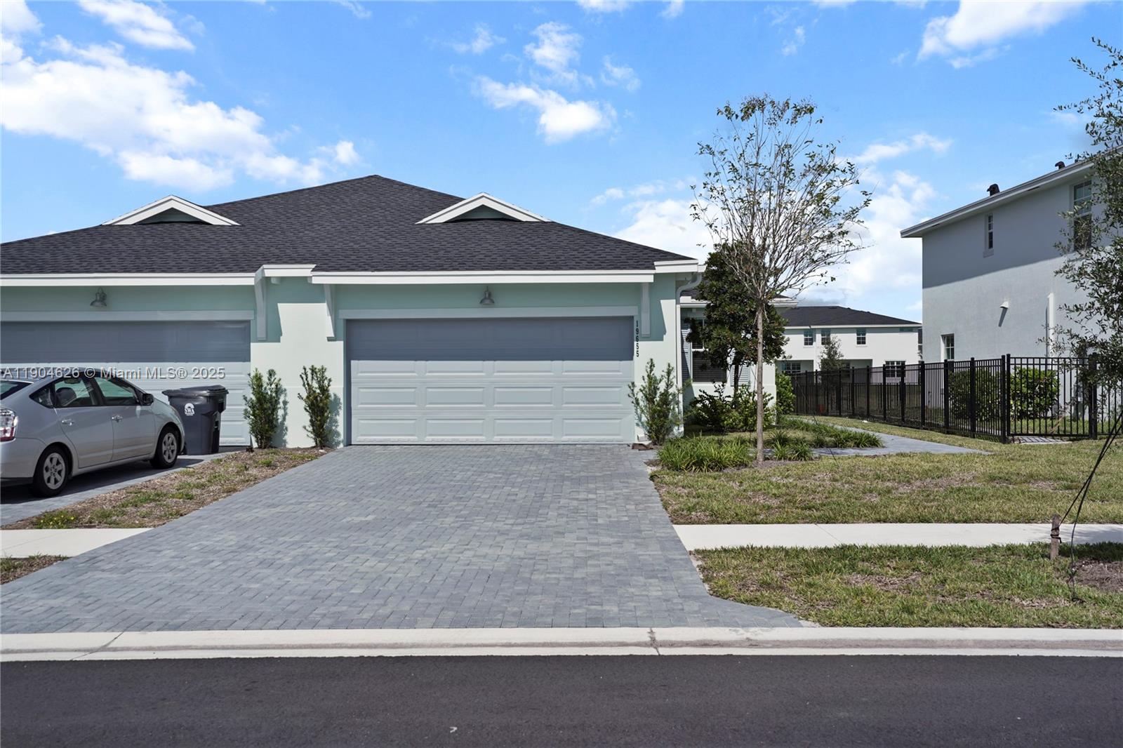 19655 Barn Swallow Way, Unit 19655 West Palm Beach, FL 33470 - Photo 1 of 59 a front view of a house with garden