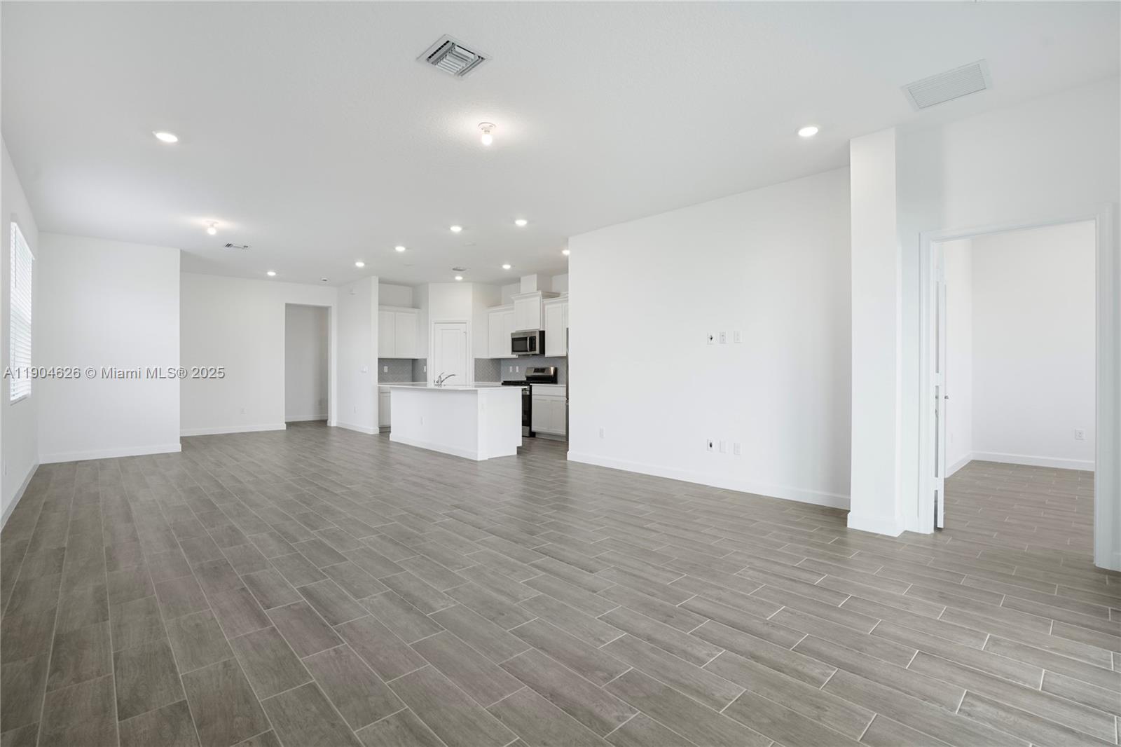 19655 Barn Swallow Way, Unit 19655 West Palm Beach, FL 33470 - Photo 14 of 59 a view of kitchen with a sink refrigerator and a window