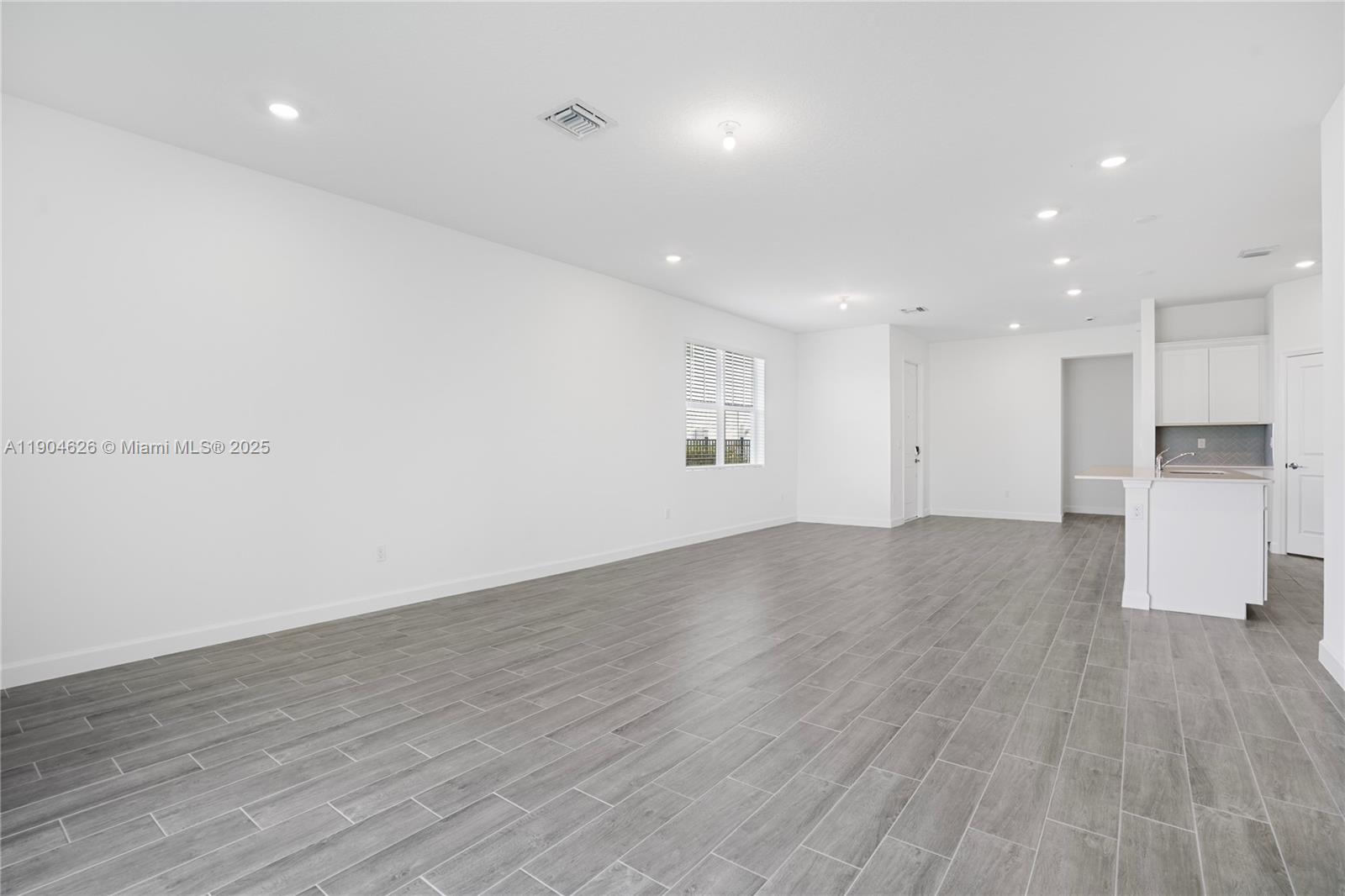 19655 Barn Swallow Way, Unit 19655 West Palm Beach, FL 33470 - Photo 15 of 59 a view of empty room with wooden floor