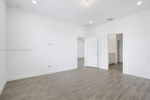 a bathroom with a double vanity sink and mirror