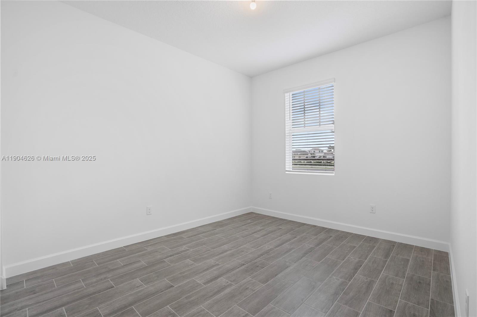 19655 Barn Swallow Way, Unit 19655 West Palm Beach, FL 33470 - Photo 19 of 59 wooden floor in an empty room