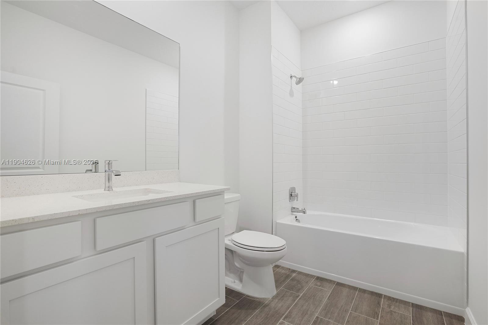 19655 Barn Swallow Way, Unit 19655 West Palm Beach, FL 33470 - Photo 23 of 59 a bathroom with a sink a toilet and shower