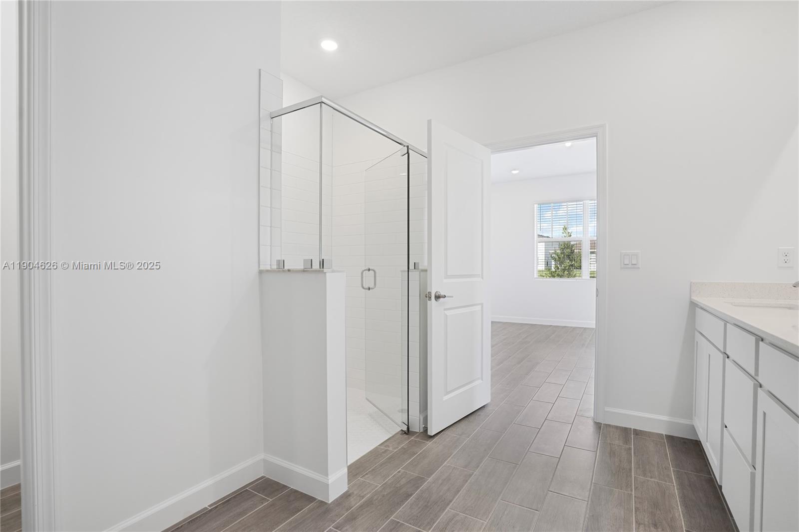 19655 Barn Swallow Way, Unit 19655 West Palm Beach, FL 33470 - Photo 28 of 59 a view of a hallway with wooden floor
