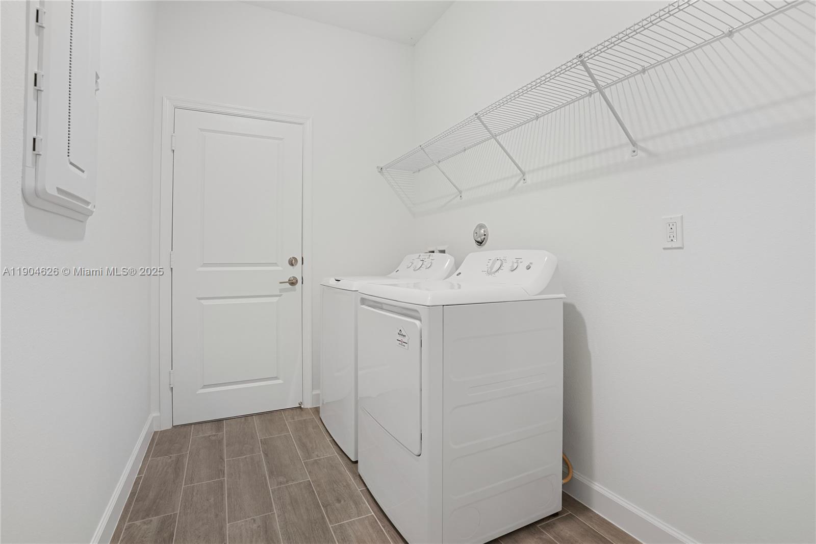 19655 Barn Swallow Way, Unit 19655 West Palm Beach, FL 33470 - Photo 29 of 59 a utility room with dryer and washer