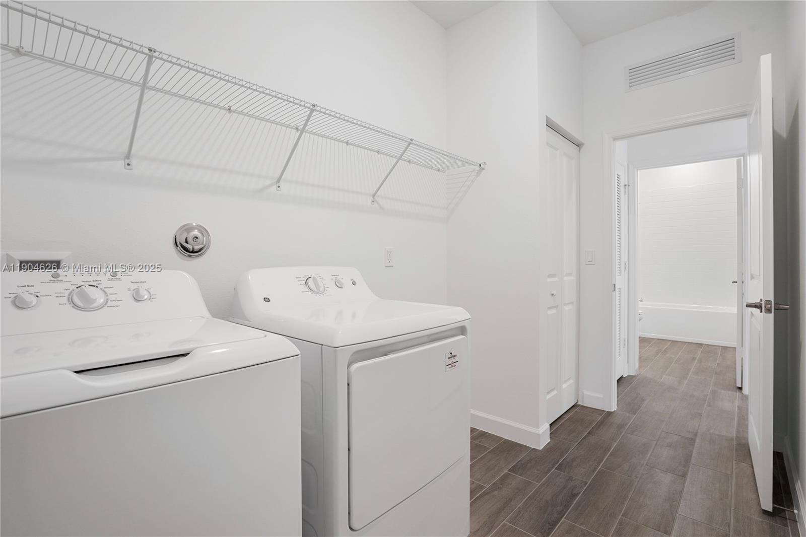 19655 Barn Swallow Way, Unit 19655 West Palm Beach, FL 33470 - Photo 30 of 59 a utility room with dryer and washer