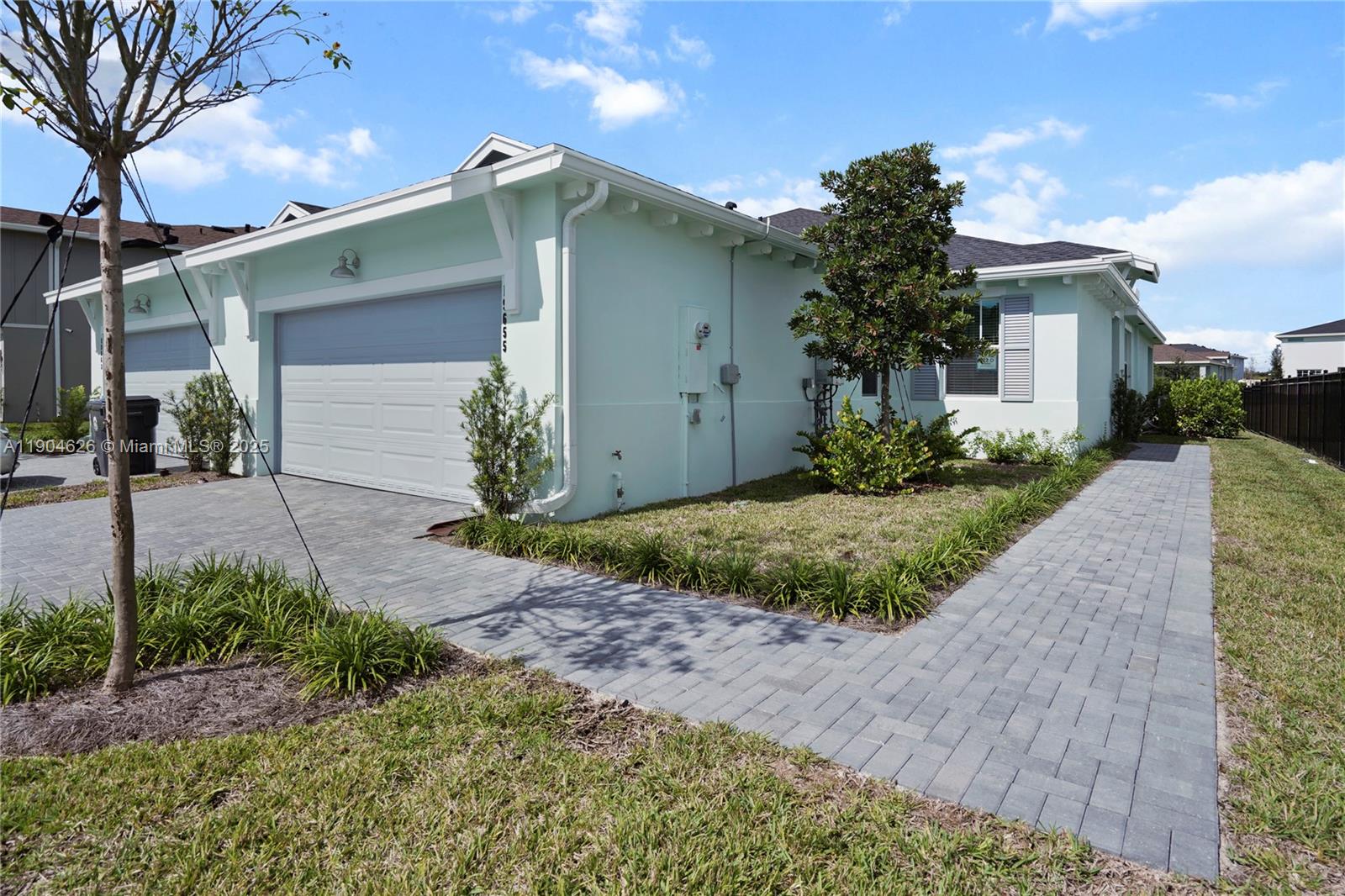 19655 Barn Swallow Way, Unit 19655 West Palm Beach, FL 33470 - Photo 3 of 59 a front view of a house with garden