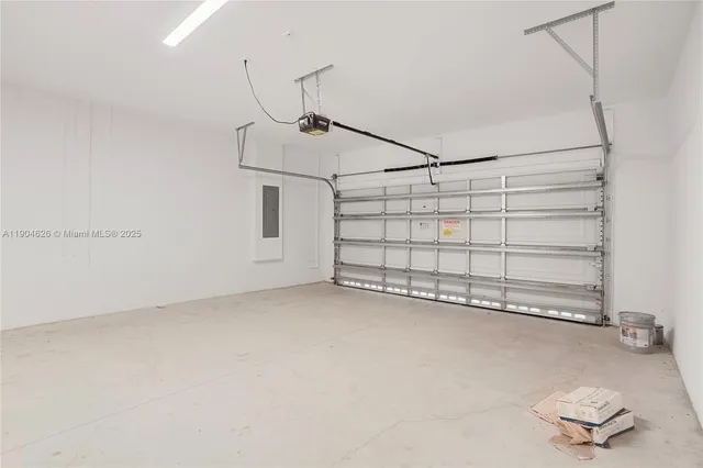 a view of a house with yard and a garden